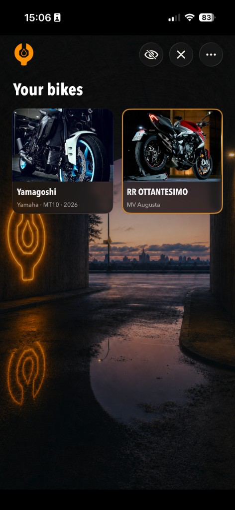 RenchLog garage overview listing every bike as a photo card in an empty night garage